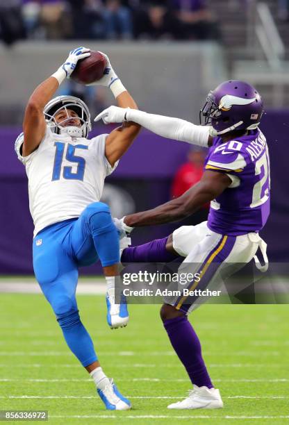 Golden Tate of the Detroit Lions catches the ball over Mackensie Alexander of the Minnesota Vikings in the second quarter of the game on October 1,...