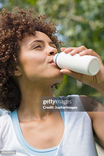 woman drinking a beverage - probiotic stock pictures, royalty-free photos & images
