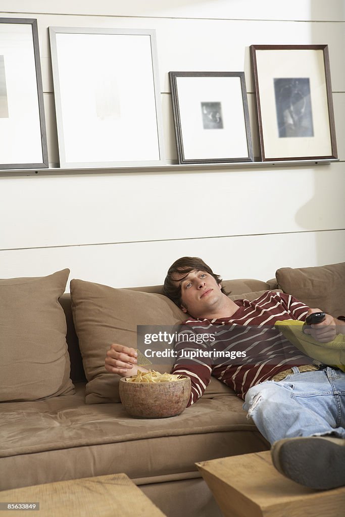 Young man watching television