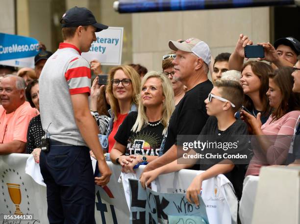 Jordan Spieth of the U.S. Team greets fans on the Today Show prior to the start of the Presidents Cup at Liberty National Golf Club on September 26...