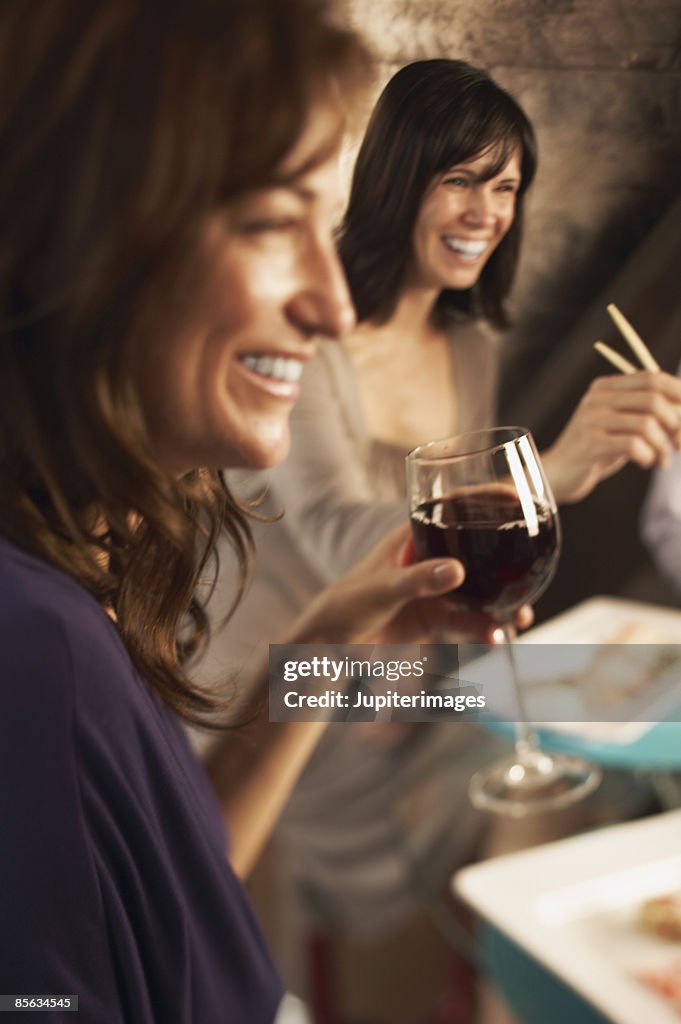 Smiling women with wine