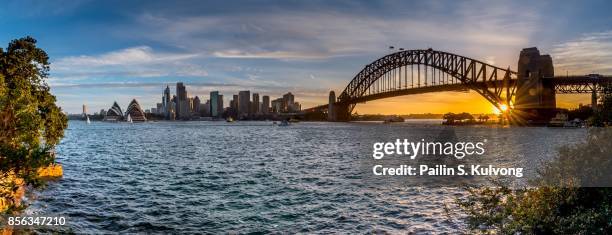 sunset at sydney opera house and harbour bridge at milson point, kirribilli, new south wales, australia - sydney harbour bridge opera house stock pictures, royalty-free photos & images