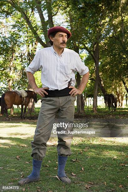 man with hands on hips - gaucho stock pictures, royalty-free photos & images
