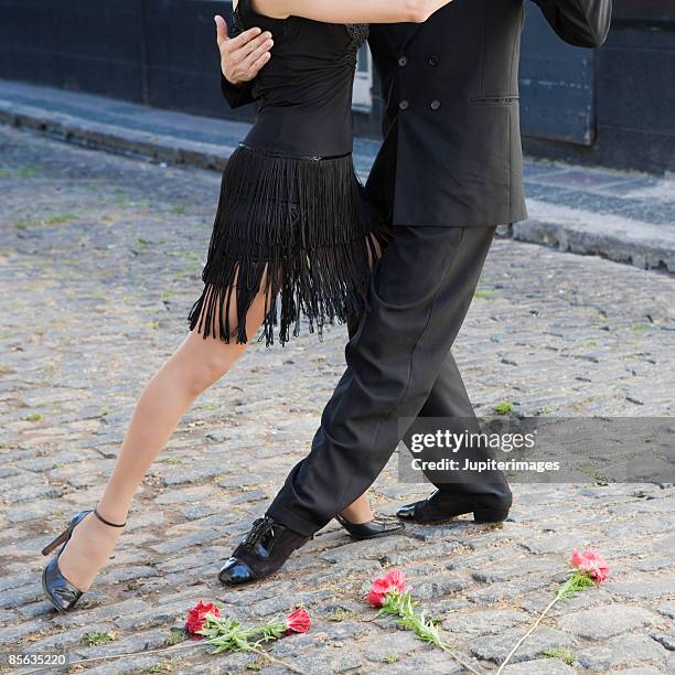 cropped dancing couple - tango black stock-fotos und bilder