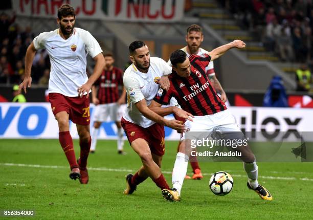 Nicola Kalinic of AC Milan is in action against Kostas Manolas of Roma during the Serie A 2017/18 match between AC Milan and AS Roma at Stadio...