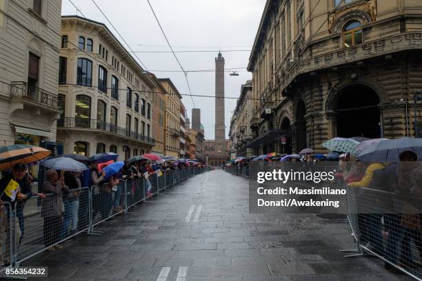 People attends under the rain the pastoral visit of Pope Francis on October 1, 2017 in Bologna, Italy. Pope Francis visits Bologna for the first time...