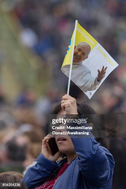 Woman attend a holy mass at the Renato Dall'Ara Stadium during a pastoral visit of Pope Francis on October 1, 2017 in Bologna, Italy. Pope Francis...