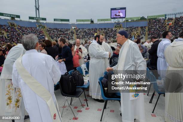 Priests wear vestments before an holy mass of Pope Francis at the Renato Dall'Ara Stadium on October 1, 2017 in Bologna, Italy. Pope Francis visits...