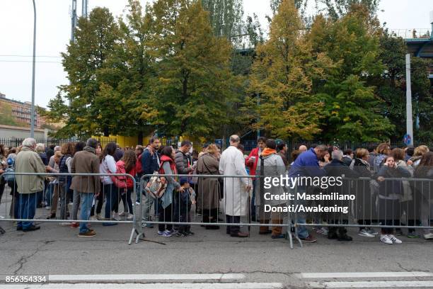 People attend a holy mass at the Renato Dall'Ara Stadium during a pastoral visit of Pope Francis on October 1, 2017 in Bologna, Italy. Pope Francis...