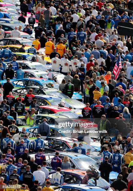 General view of pit road during the National Anthem prior to the Monster Energy NASCAR Cup Series Apache Warrior 400 presented by Lucas Oil at Dover...