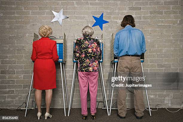 back view of voters at voting booths - old voting booth stock pictures, royalty-free photos & images
