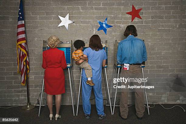 back view of voters and child at voting booths - young voters stockfoto's en -beelden