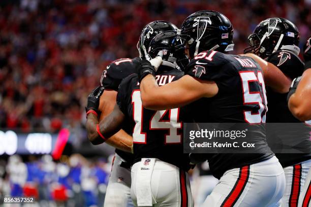 Justin Hardy of the Atlanta Falcons celebrates a touchdown during the second half against the Buffalo Bills at Mercedes-Benz Stadium on October 1,...