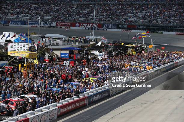 General view of pit road during the National Anthem prior to the Monster Energy NASCAR Cup Series Apache Warrior 400 presented by Lucas Oil at Dover...