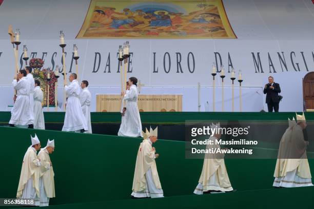 Priests reach the altar for a holy mass of Pope Francis at the Renato Dall'Ara Stadium on October 1, 2017 in Bologna, Italy. Pope Francis visits...