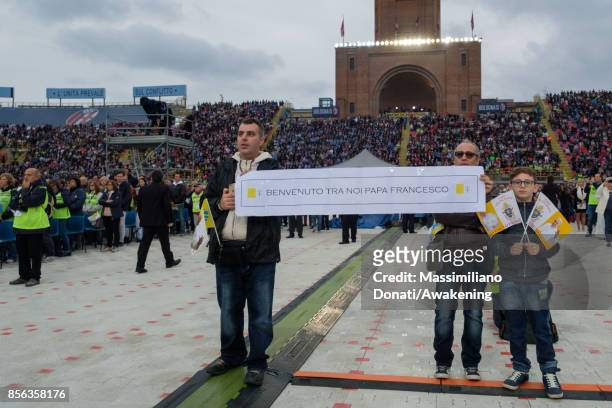 People show banners to Pope Francis before a holy mass at the Renato Dall'Ara Stadium on October 1, 2017 in Bologna, Italy. Pope Francis visits...
