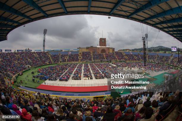 People attend a holy mass at the Renato Dall'Ara Stadium during a pastoral visit of Pope Francis on October 1, 2017 in Bologna, Italy. Pope Francis...