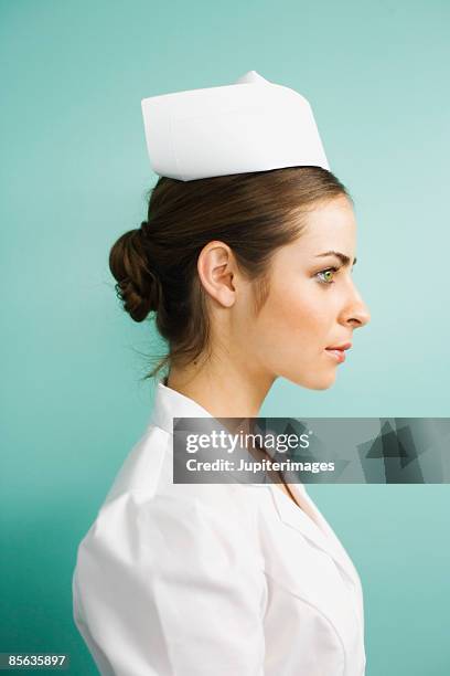 profile of nurse - nurse hat stock pictures, royalty-free photos & images