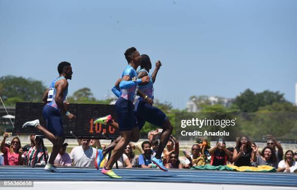 Sprinter Justin Gatlin and U.S sprinter Isiah Young competes during the 'Mano a Mano Athletics Challenge' at the Brazilian Jockey Club on October 01,...