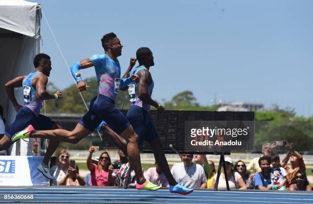 Sprinter Justin Gatlin and U.S sprinter Isiah Young competes during the 'Mano a Mano Athletics Challenge' at the Brazilian Jockey Club on October 01,...