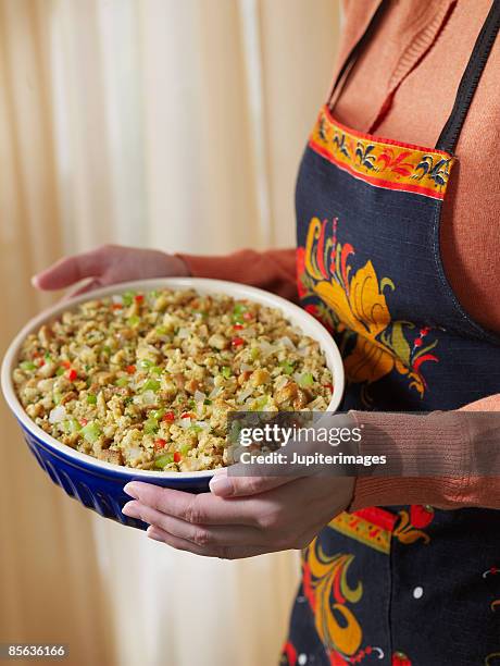 woman holding stuffing - side dish stock pictures, royalty-free photos & images