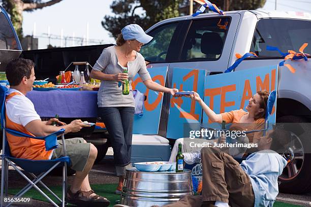 friends enjoying tailgate party - four people in car stock pictures, royalty-free photos & images