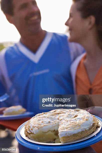 people with sliced lemon meringue pie - key lime stock pictures, royalty-free photos & images