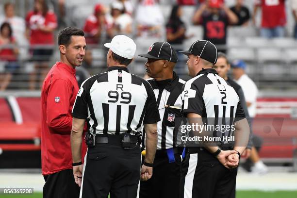 Head coach Kyle Shanahan of the San Francisco 49ers talks with referee Tony Corrente before the start of the NFL game against the Arizona Cardinals...