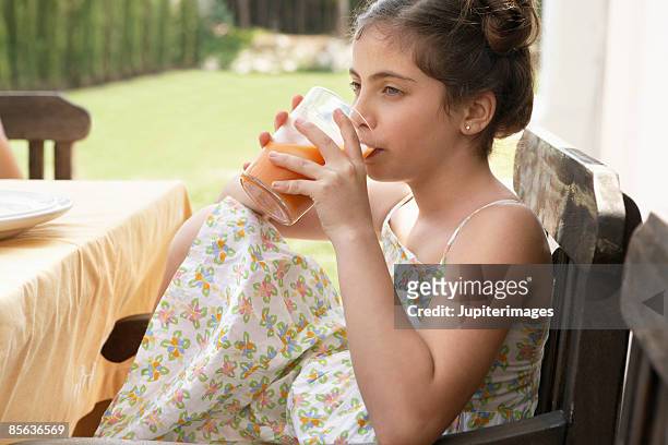 girl drinking gazpacho from glass - gazpacho stock pictures, royalty-free photos & images