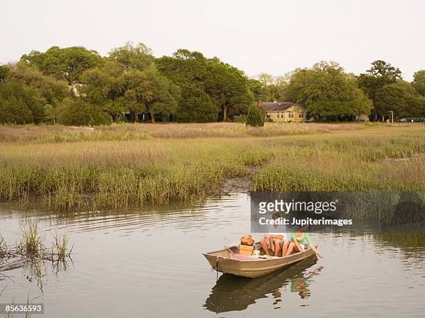 couple in rowboat - the charleston stock pictures, royalty-free photos & images