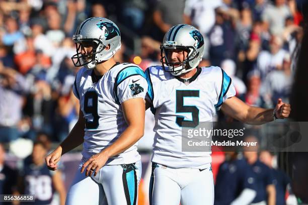 Graham Gano of the Carolina Panthers reacts with Michael Palardy after kicking a 48-yard field goal during the fourth quarter to defeat the New...