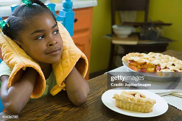 girl waiting for cooling pie - girl sitting criss cross stock pictures, royalty-free photos & images