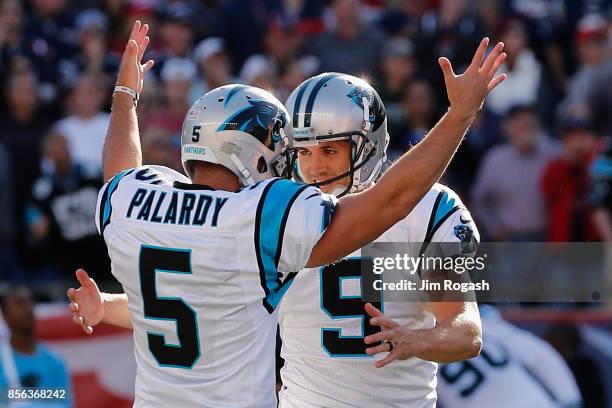 Graham Gano of the Carolina Panthers celebrates with Michael Palardy after kicking a 48-yard field goal during the fourth quarter to defeat the New...