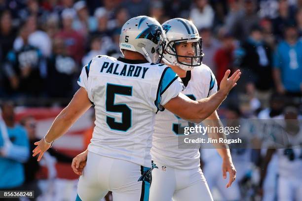 Graham Gano of the Carolina Panthers celebrates with Michael Palardy after kicking a 48-yard field goal during the fourth quarter to defeat the New...