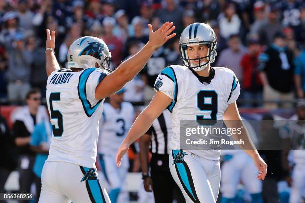 Graham Gano of the Carolina Panthers celebrates with Michael Palardy after kicking a 48-yard field goal during the fourth quarter to defeat the New...