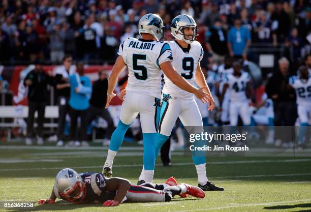 Graham Gano of the Carolina Panthers celebrates with Michael Palardy after kicking a 48-yard field goal during the fourth quarter to defeat the New...