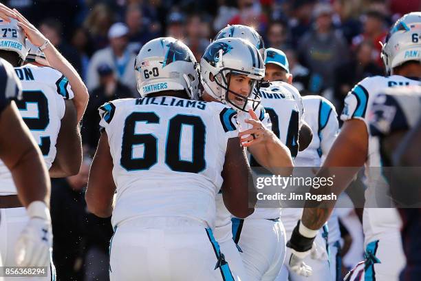 Graham Gano of the Carolina Panthers celebrates with Daryl Williams after kicking a 48-yard field goal during the fourth quarter to defeat the New...