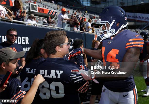 Deonte Thompson of the Chicago Bears greets some young fans prior to the game against the Pittsburgh Steelers at Soldier Field on September 24, 2017...