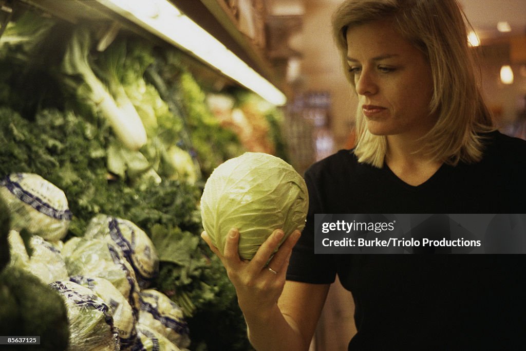 Woman selecting cabbage