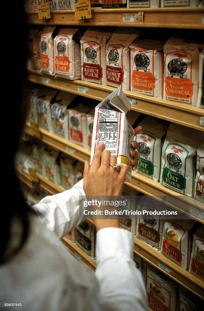 Woman reading a label