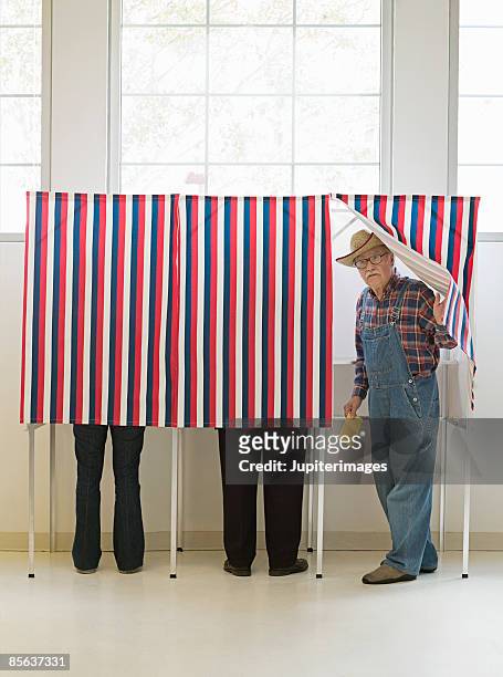 farmer emerging from voting booth - american voting booth stock pictures, royalty-free photos & images