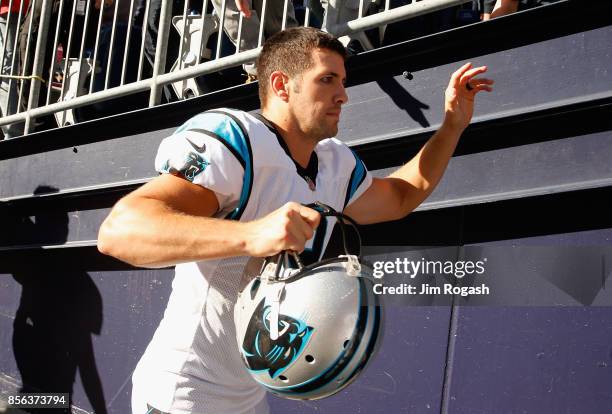 Graham Gano of the Carolina Panthers runs off the field after kicking a 48-yard field goal during the fourth quarter to defeat the New England...