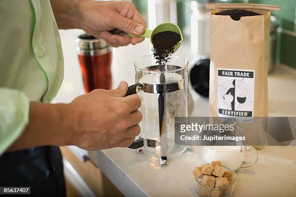 man making coffee - eerlijke handel stockfoto's en -beelden