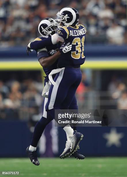Kayvon Webster and Maurice Alexander of the Los Angeles Rams celebrate after a turnover on downs by the Dallas Cowboys in the fourth quarter at AT&T...