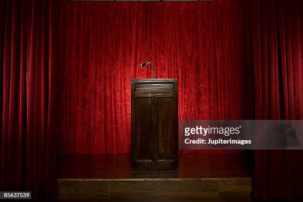 lectern on stage - lectern stock pictures, royalty-free photos & images
