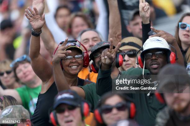 Race fans cheer during the Monster Energy NASCAR Cup Series Apache Warrior 400 presented by Lucas Oil at Dover International Speedway on October 1,...