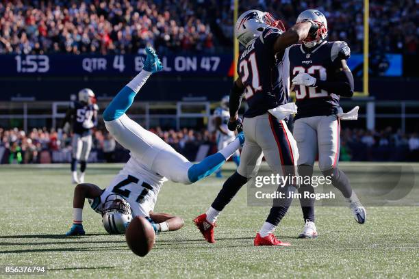 Devin Funchess of the Carolina Panthers is upended during the second half against the New England Patriots at Gillette Stadium on October 1, 2017 in...