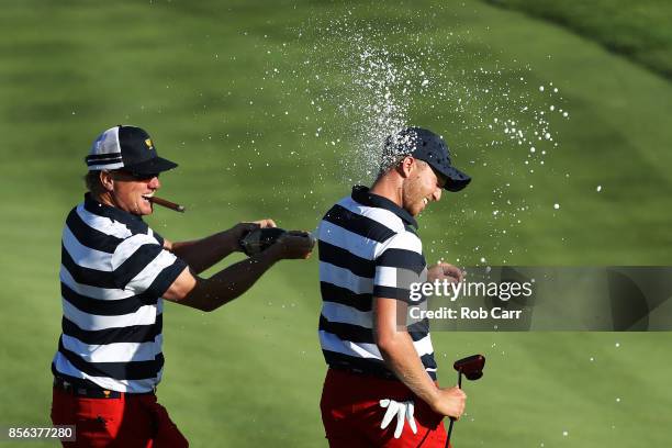 Charlie Hoffman sprays Daniel Berger of the U.S. Team with champagne after Berger defeated Si Woo Kim of South Korea and the International Team on...