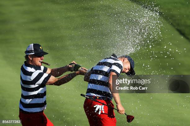 Charlie Hoffman sprays Daniel Berger of the U.S. Team with champagne after Berger defeated Si Woo Kim of South Korea and the International Team on...