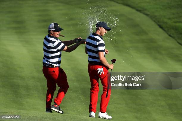 Charlie Hoffman sprays Daniel Berger of the U.S. Team with champagne after Berger defeated Si Woo Kim of South Korea and the International Team on...